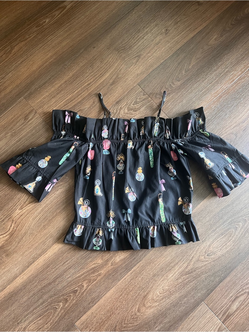 H&M Black Off-Shoulder Ruffle Top with Multicolor Perfume Print, size 36(6)
